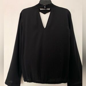Trina Turk top, Black size M. 100% silk. Wrap front. Full sleeves. Choke collar.